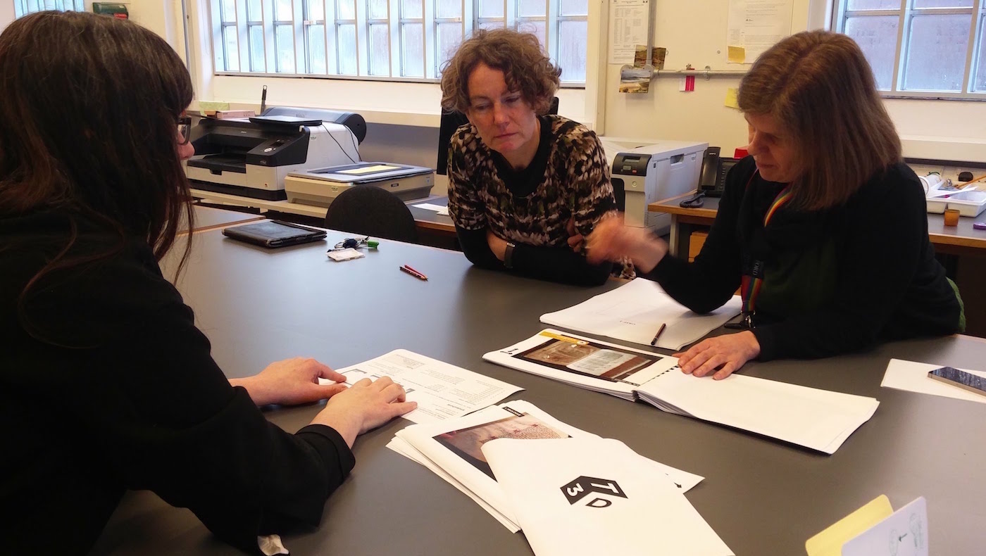 Madeline Slaven (centre), Sallyanne Gilchrist (right), and Laura Moretti (left) discussing different options for the exhibition.