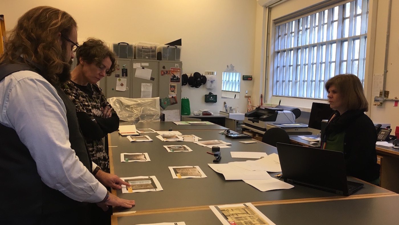 Madeline Slaven (centre), Sallyanne Gilchrist (right), and Daryl Green (left) discussing different options for the exhibition.