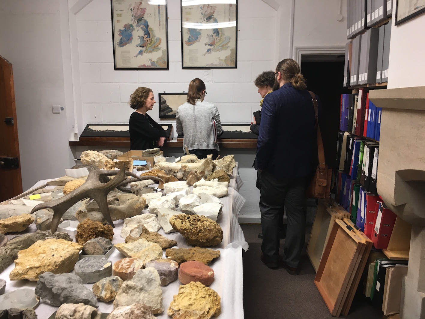 Janet Stott, Madeline Slaven, Daryl Green, and Kelly Richards examining objects related to our project.