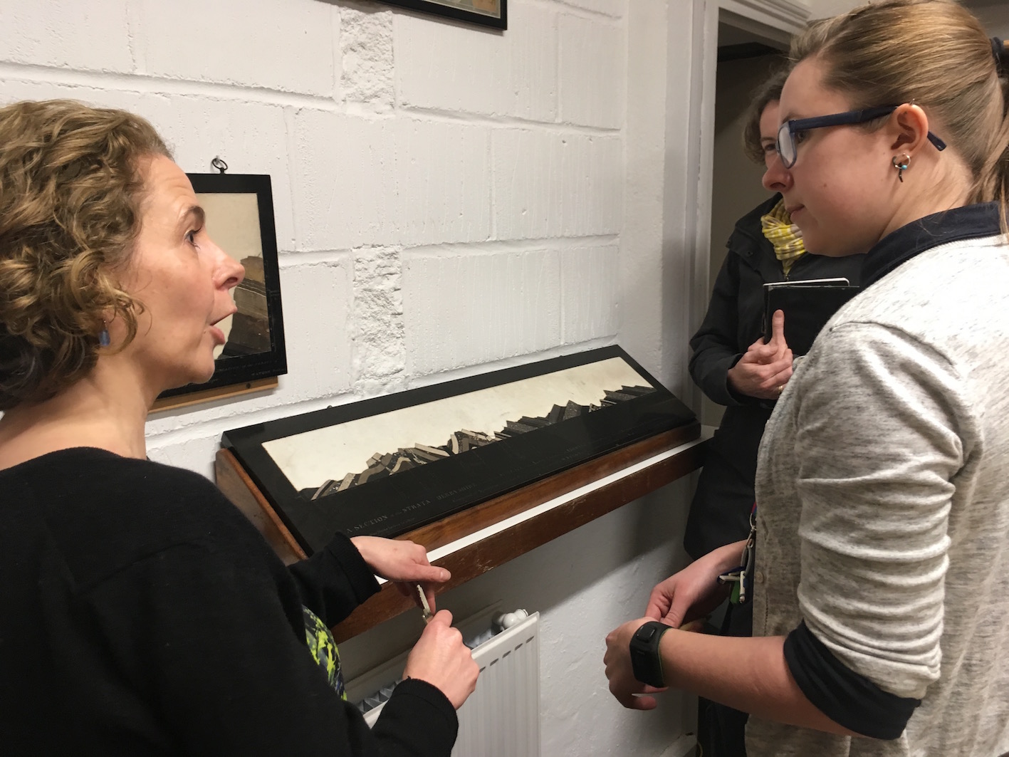 Janet Stott, Madeline Slaven, and Kelly Richards considering objects for a potential exhibition at the Oxford University Museum of Natural History.