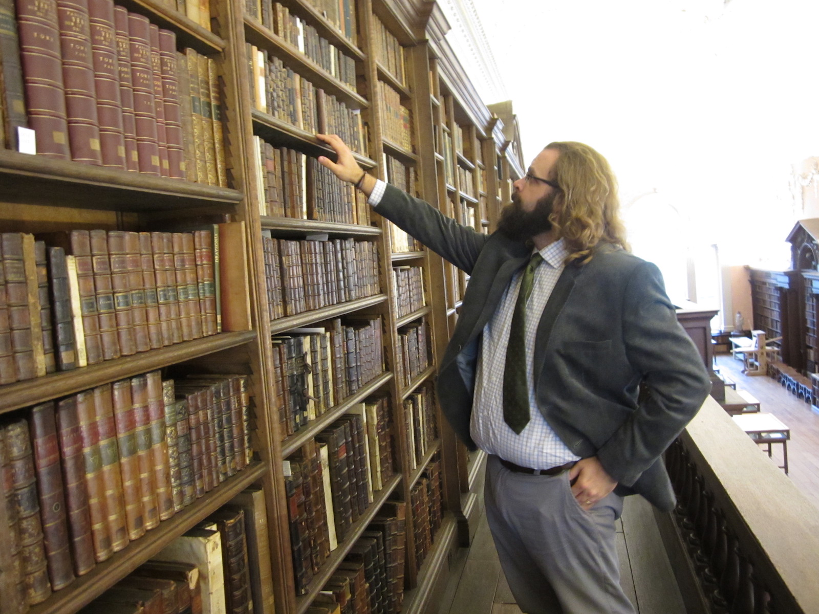 "Daryl in front of Charles Boyle's books"